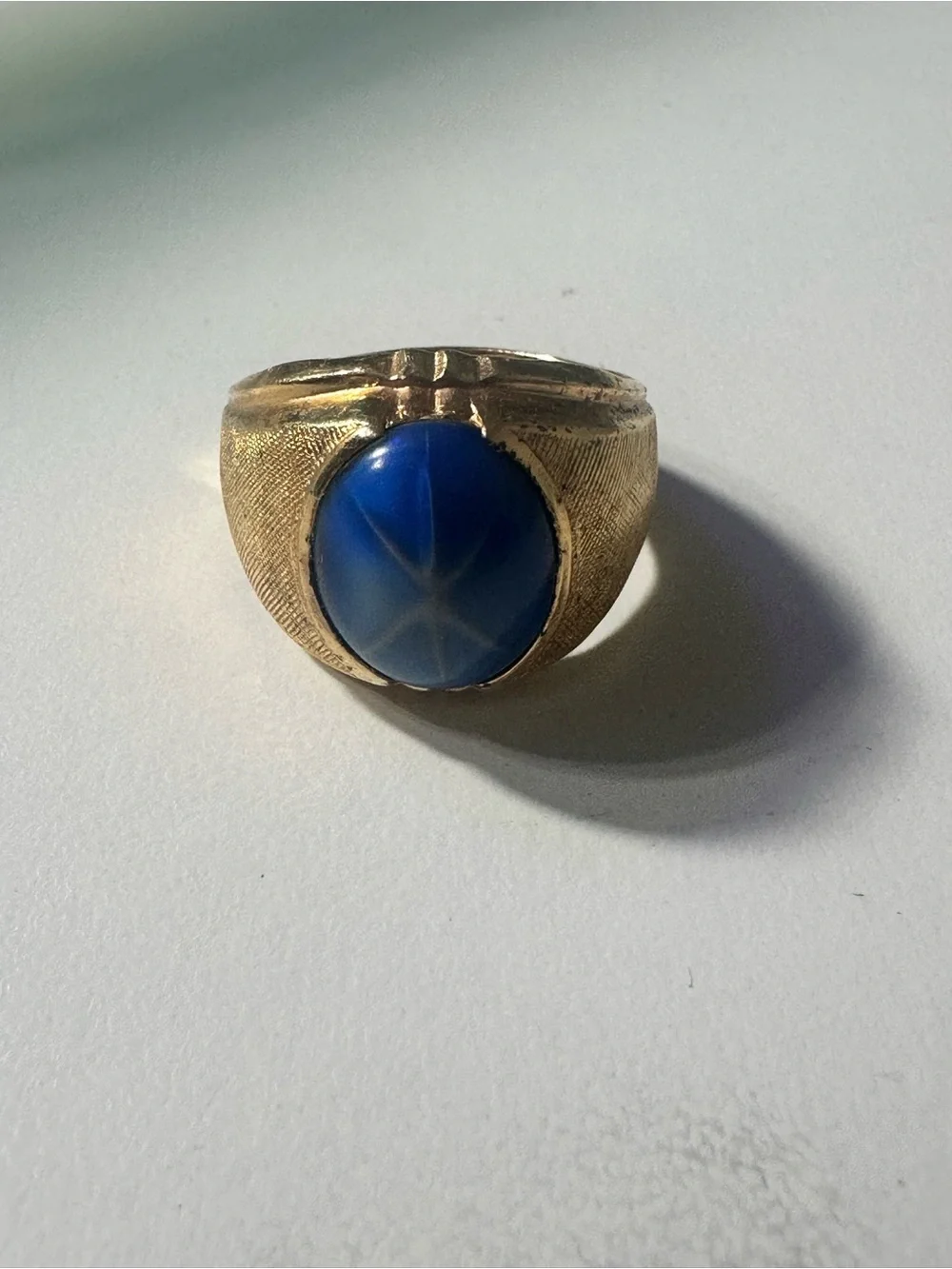 Gold-Tone electroplated size 7 Ring with Blue Oval sapphire men’st